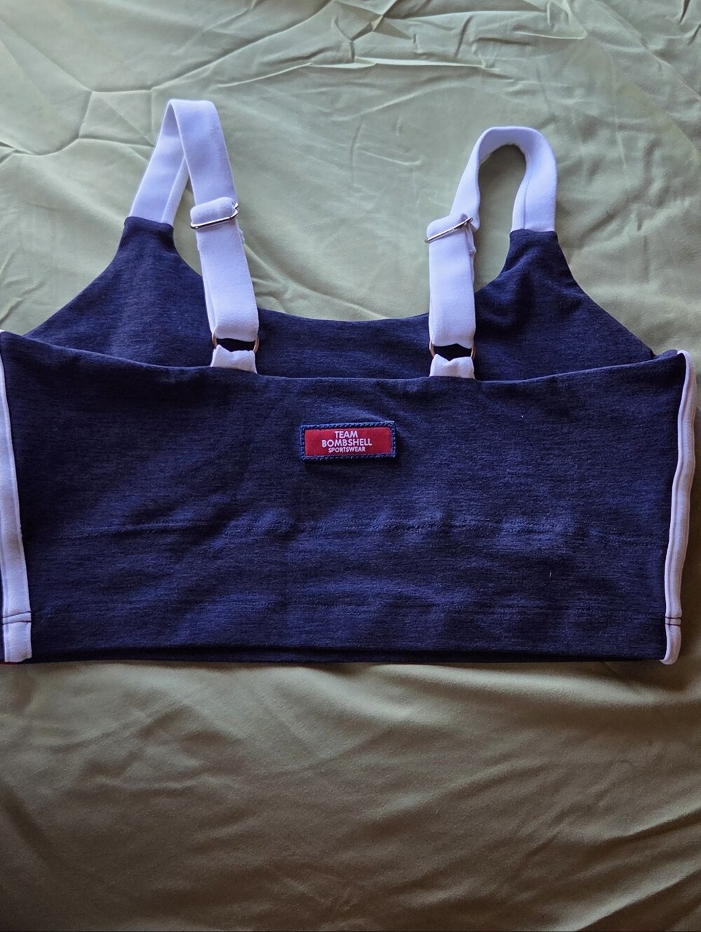 Bombshell Sportswear Navy Sports Bra with White Straps and Red Trim